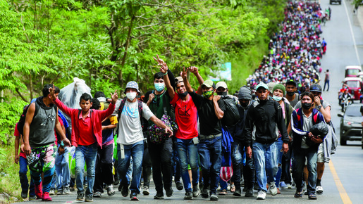 Migrants walk across Guatemala